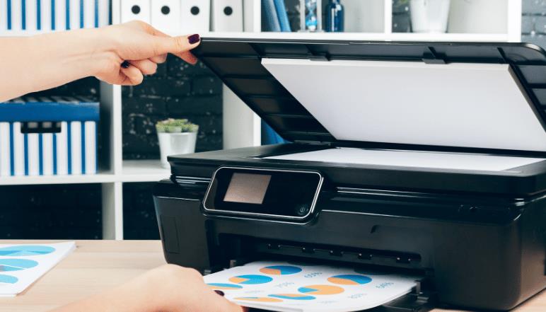 Compact all-in-one inkjet printer with built-in control panel, used in offices for printing, scanning, and copying documents as part of office technology and document management solutions.